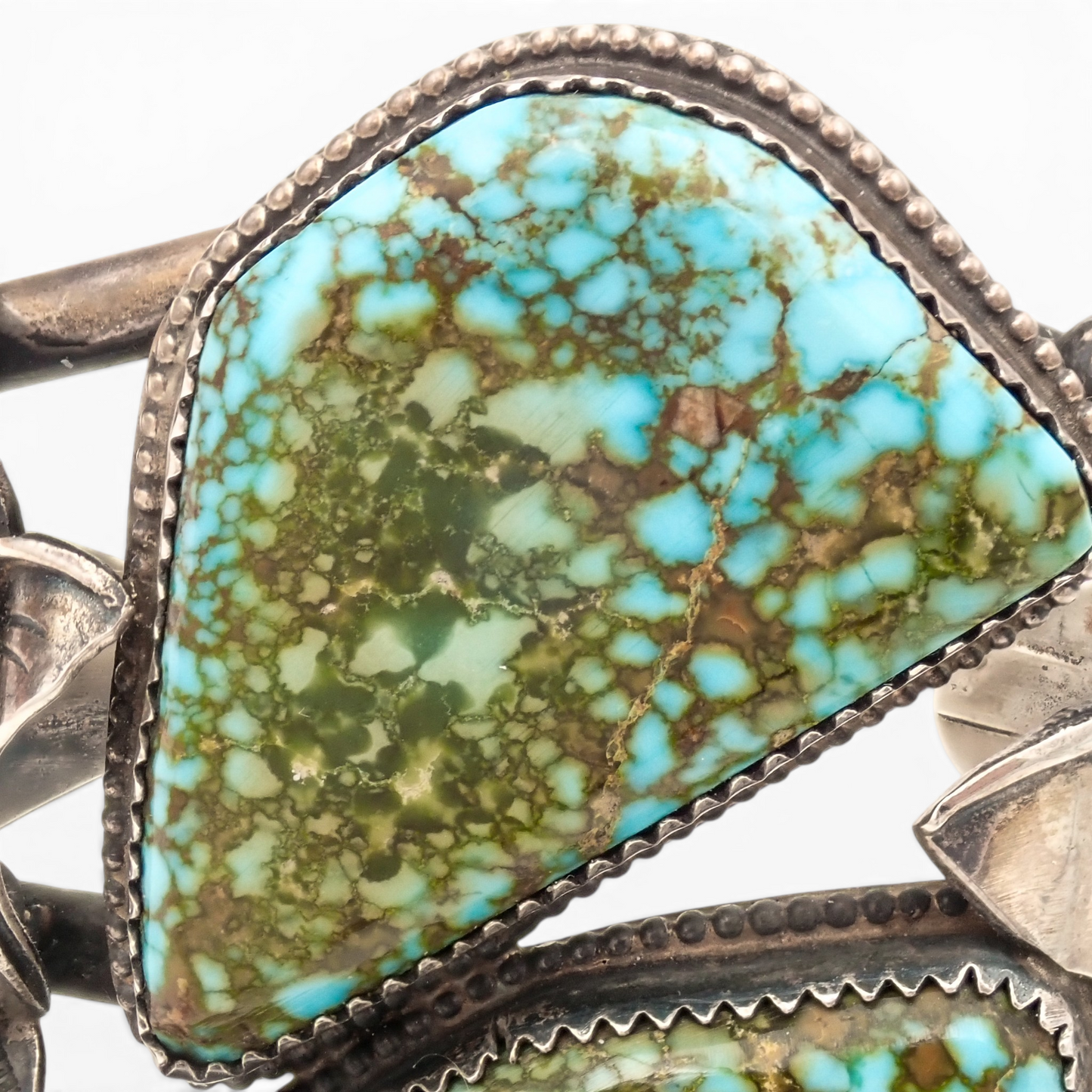 Two-Stone Turquoise Mountain Spiderweb & Sculptural Floral Sterling Cuff Bracelet by Navajo artisan M. CHAVEZ